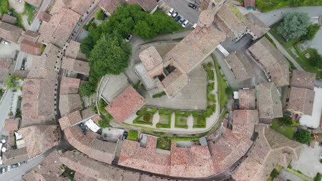 serralunga d'alba, langhe region, cuneo, piedmont, italy. 4k aerial view of the town and vineyards. langhe-roero and monferrato. top down view zenital descending above the caslte.