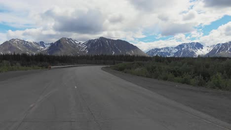 4k drone video of mountain peaks and granite creek near denali national park in alaska on sunny summer day