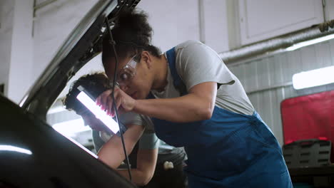 Two-women-working-on-a-vehicle