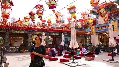 colorful lanterns and visitors at hong kong temple