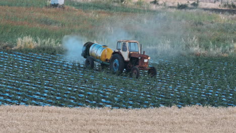 tractor sprays water or fertilizer irrigation