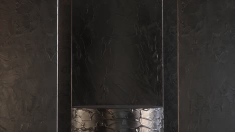 black shiny cylinder stand with acrylic paint in studio 3d render animation