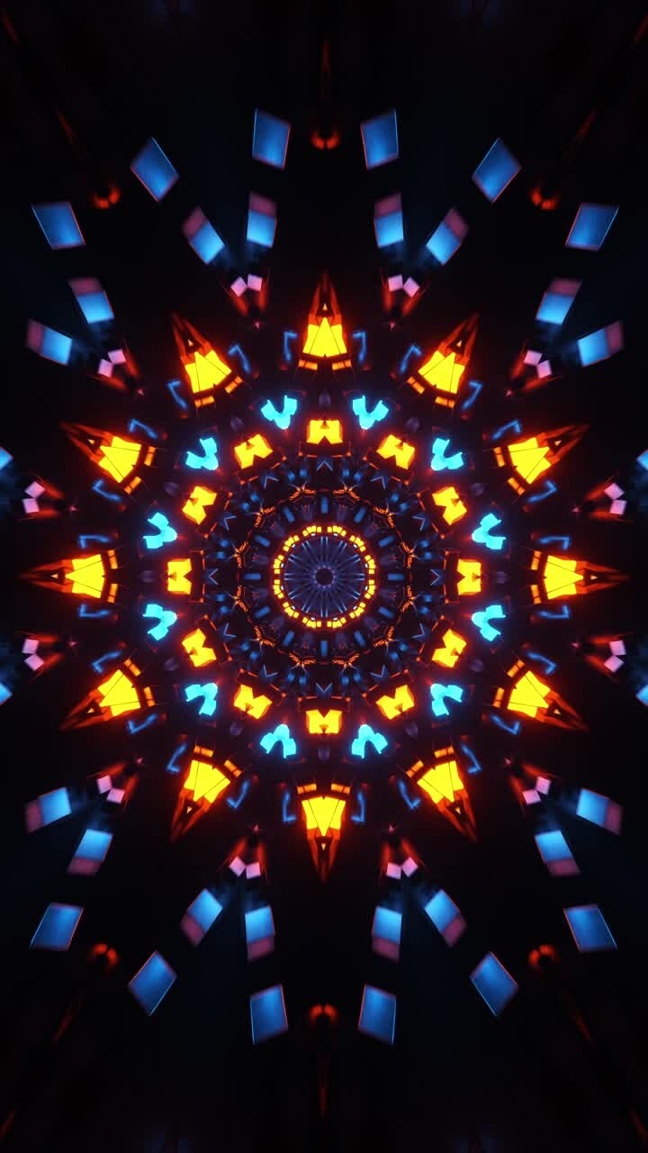 Colorful animation design is shown in the dark. Kaleidoscope VJ loop Vertical