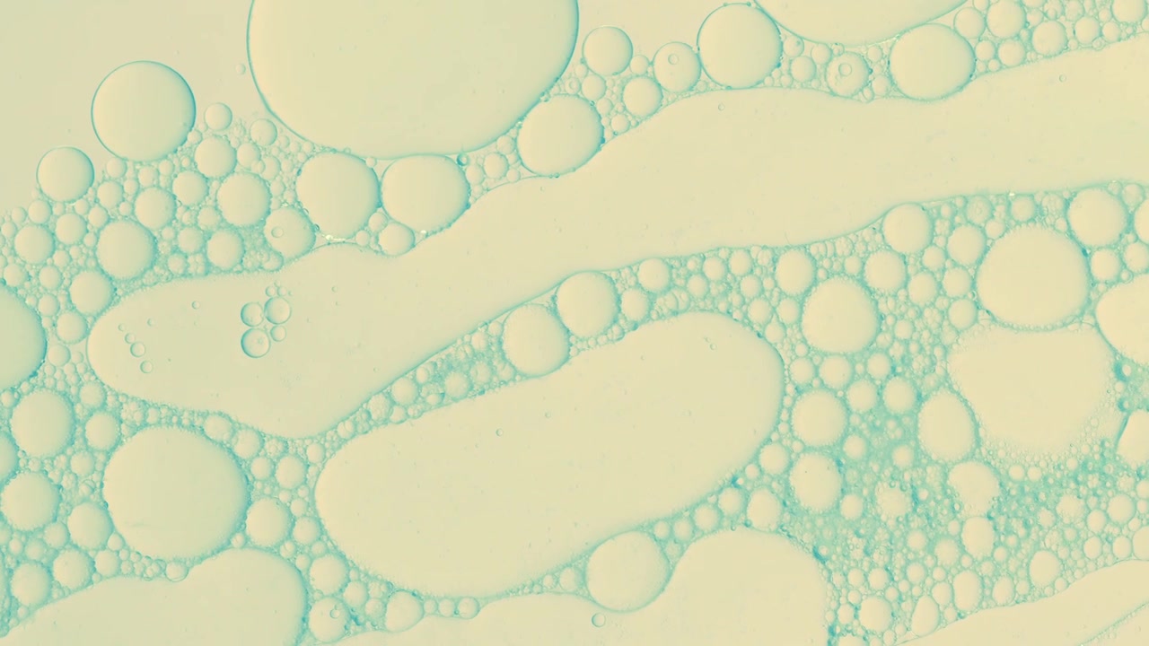 Sfondo astratto di gocce d'olio in liquido brillante per trattamenti cosmetici Idrogeno