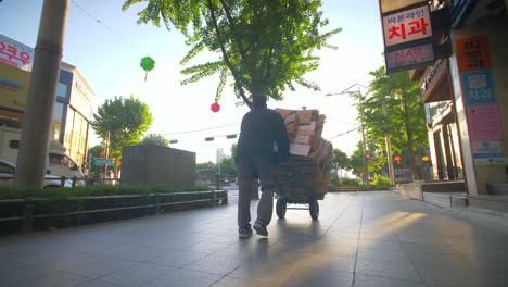 man with hand truck at dawn