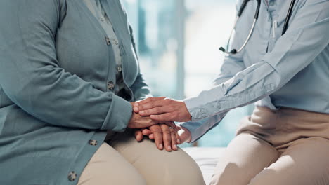 doctor holding patient's hand, showing support and care