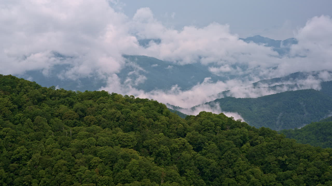 The Smokies lost in vapor — drone shot of clouds and mist converging