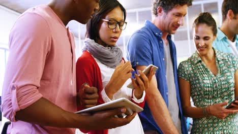 business executives using mobile phone and digital tablet