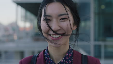 beautiful laughing asian woman portrait of young corporate student happy