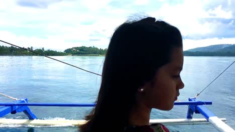 beautiful young girl riding a boat in the philippines