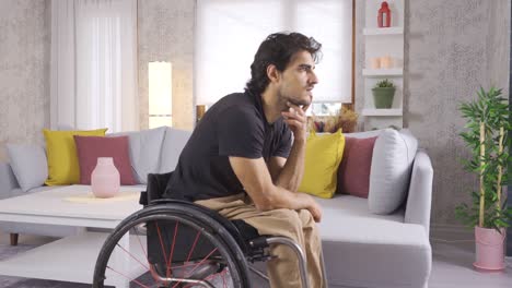 Trauriger-Behinderter-Junger-Mann,-Der-In-Seinem-Rollstuhl-Sitzt.