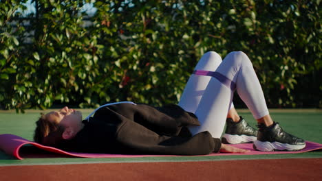 woman doing exercise with resistance band