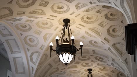 gradual pan across a room's ornate ceiling