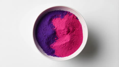 vibrant pink and purple color powder in a bowl