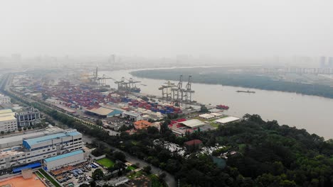 container terminal with thick smog hanging over ho chi minh city