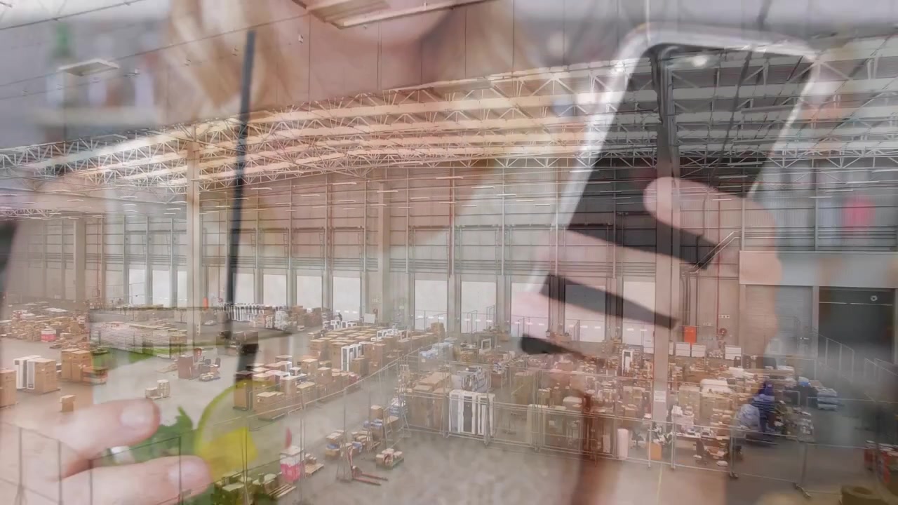 Double Exposure of Woman Using Smartphone and Busy Warehouse Interior