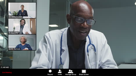 middle aged male doctor gives good news during video conference