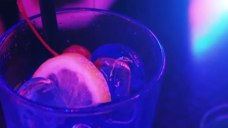 neon blue cocktail at a nightclub