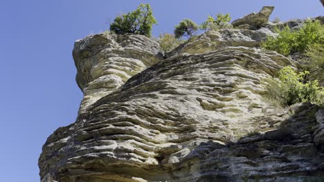 Exciting-rock-in-nature-with-individual-stones-seen-over-time-with-different-colors-in-the-forest-in-the-sun