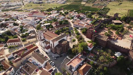 Rotating-aerial-over-the-old-town-of-Silves-in-Algarve,-Portugal