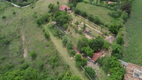 Aerial-view-of-Oaxaca,-Mexico-showcasing-lush-greenery,-pools,-and-rural-homes