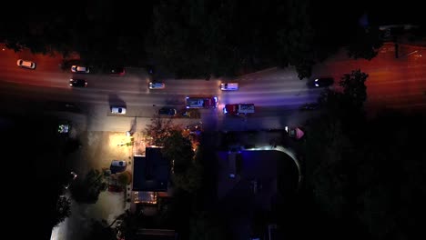 aerial shot of a firebrigade blaring horn and rushing through traffic