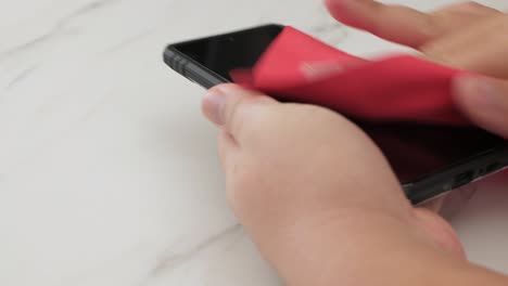 people cleaning and disinfecting mobile smartphones