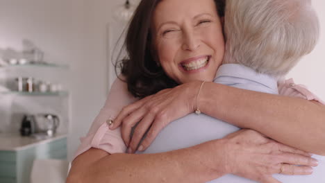 happy old couple hugging enjoying romantic relationship sharing good news embracing at home