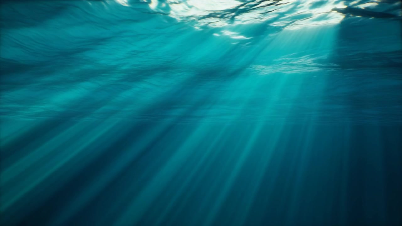 Sunlight Beams Piercing Through Deep Blue Ocean Water