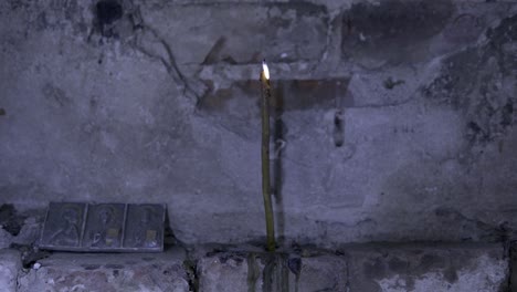 burning candle in a church or chapel