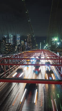 night view of the brooklyn bridge with city lights