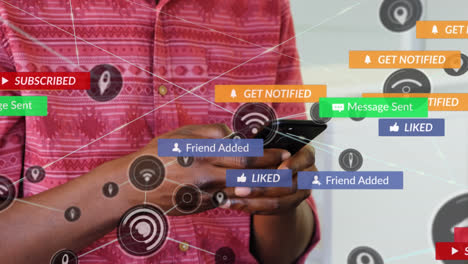 animation of connected icons, notifications over midsection of african american man using cellphone