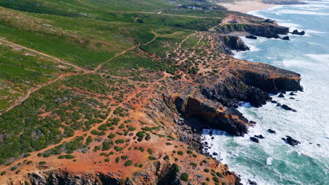 aerial beautiful littoral landscape with stormy sea crashing of rocky shoreline.