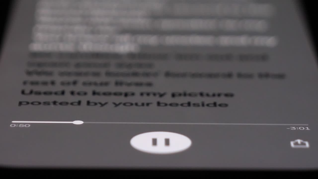 Listening to music on Spotify app, close up view