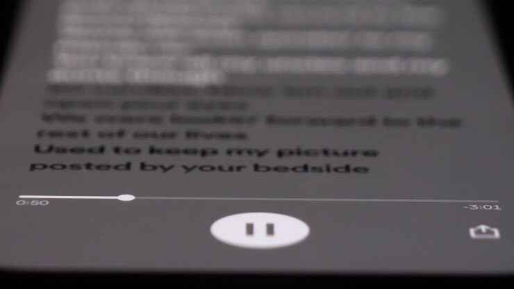 Listening to music on Spotify app, close up view