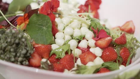 salad with strawberries mozzarella and flowers