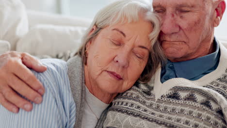 Love,-happy-and-senior-couple-hugging-on-a-sofa