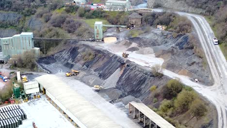 quarry tipper collecting and dropping gravel