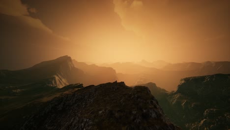 high mountain peaks covered with dramatic heavy fog