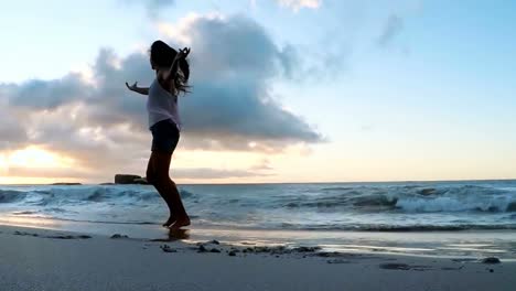 woman dancing on the beach