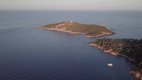 Aerial-footage-of-the-isolated-corsican-tower-of-Pinareddu-during-sunset