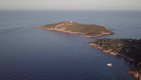 aerial footage of the isolated corsican tower of pinareddu during sunset