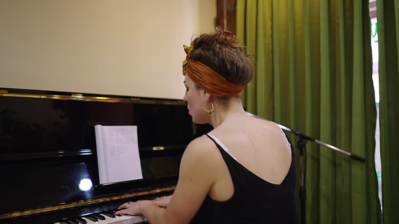 Woman Performing Music at a Piano