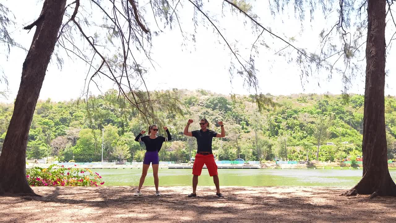 Happy Couple Dancing by the Lake