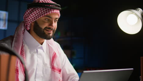 employee composing emails on laptop