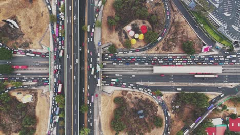 drone footage of a traffic standstill at a cloverleaf interchange in cdmx