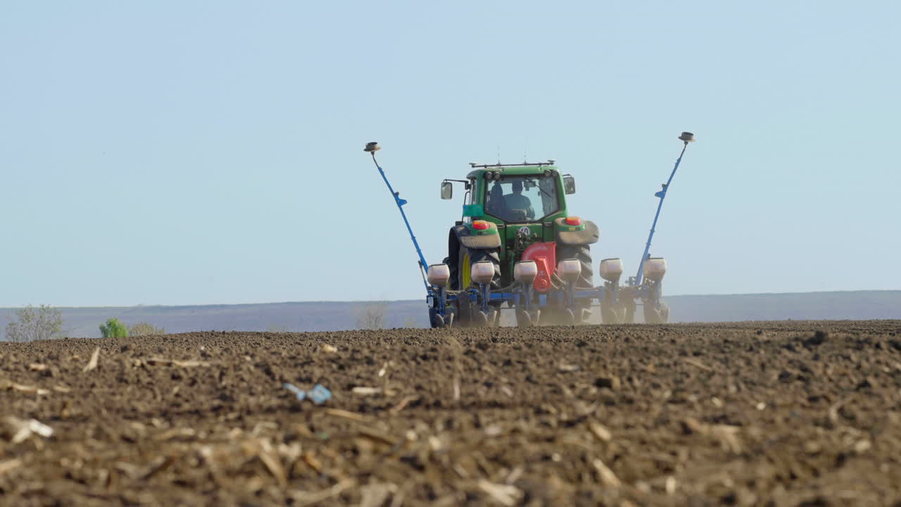 Tractor Planting Crops in a Field