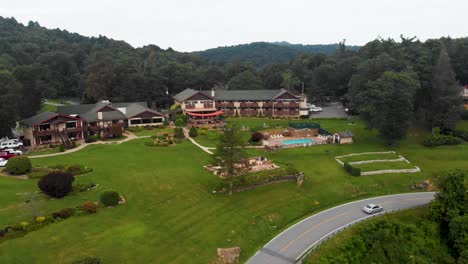 4k drone video of mountainside resort at little switzerland, nc on summer day-8