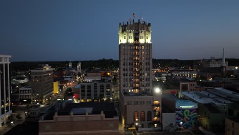 Jackson,-Michigan-downtown-at-night-with-drone-video-close-up-left-to-right