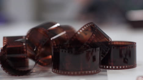 photographic film negative on a table - slowmotion